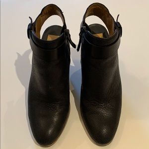 Black leather Dolce Vita booties with ankle strap.